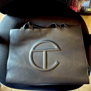 Large black Telfar shopping bag.